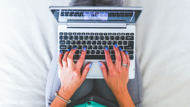 hands-woman-legs-laptop